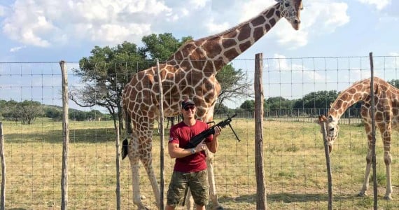 giraffe with a machine gun