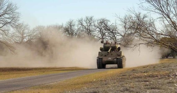 sherman tank driving dust cloud